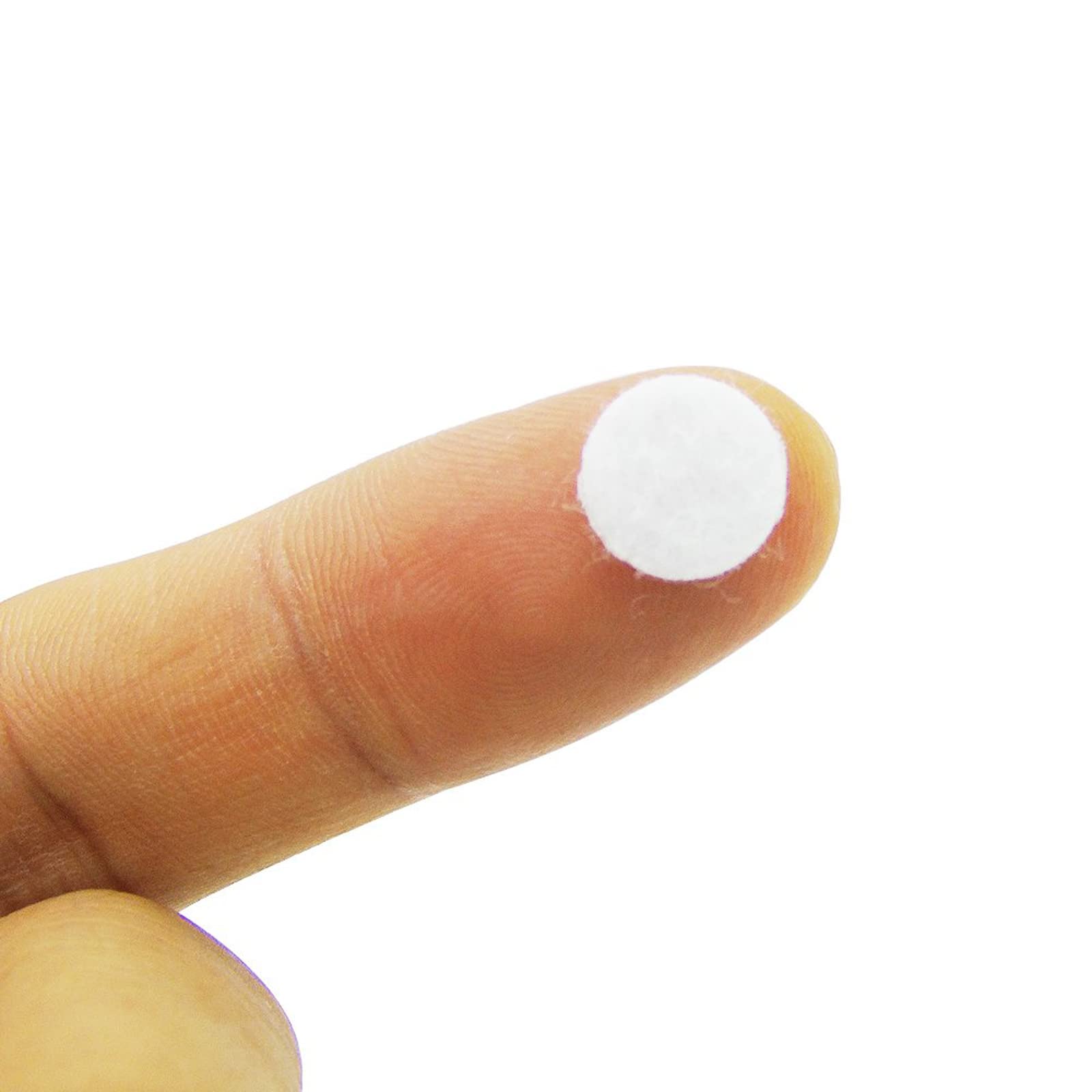 Close up view of round cotton dermabrasion machine replacement pads