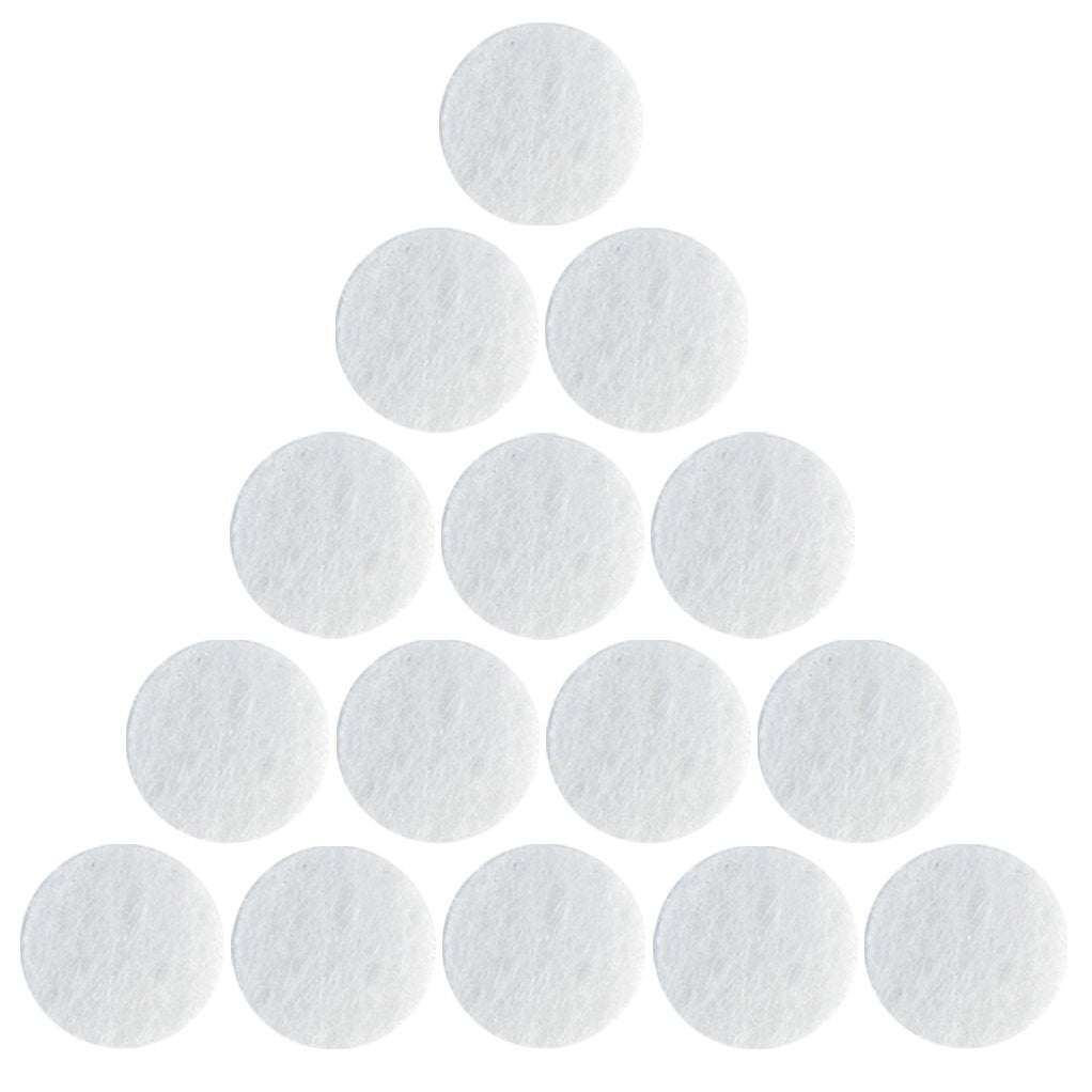 Close up view of a single ten millimeter white cotton filter replacement for facial vacuum suction machines.