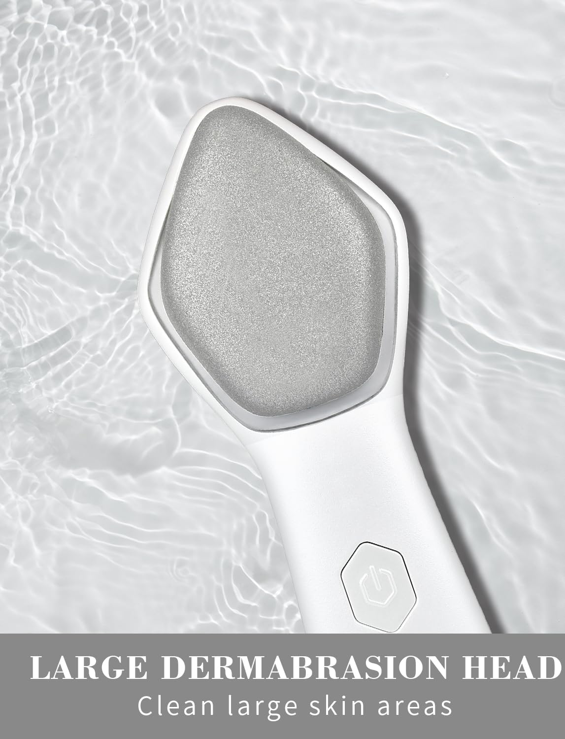 NEWDERMO diamond microdermabrasion tool showing the patented large diamond grit head close up.
