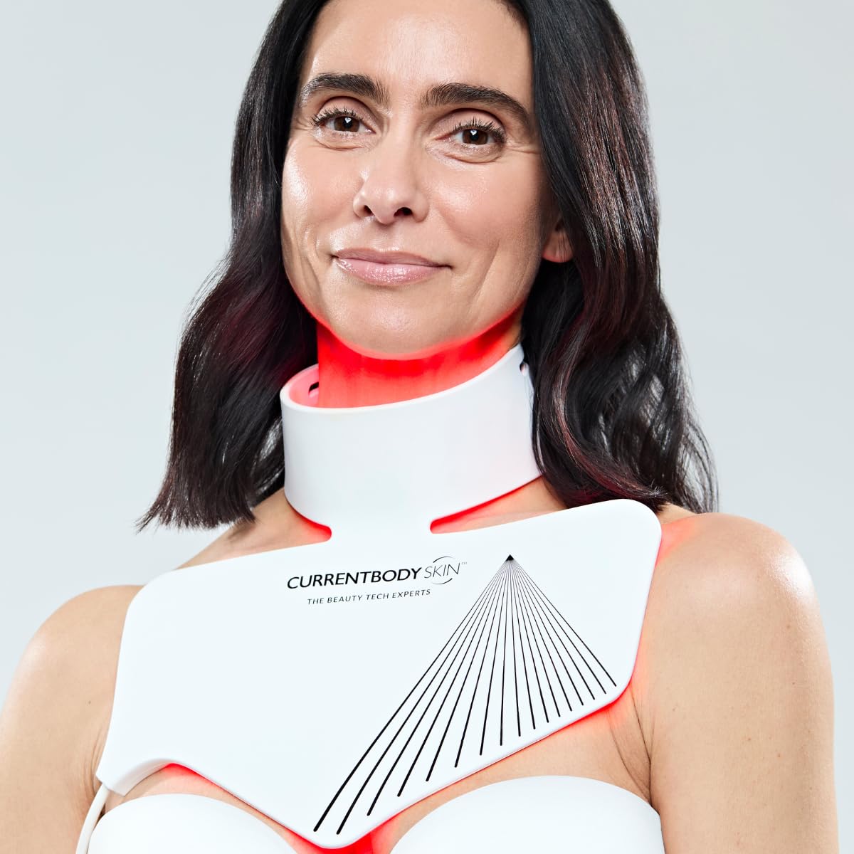 CurrentBody Skin LED neck mask worn by user