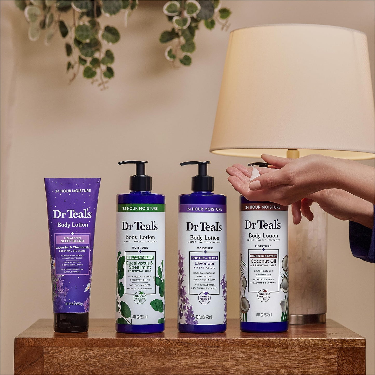 Dr Teal's 24 Hour Moisture Lavender body lotion set of three bottles arranged on a clean bathroom counter