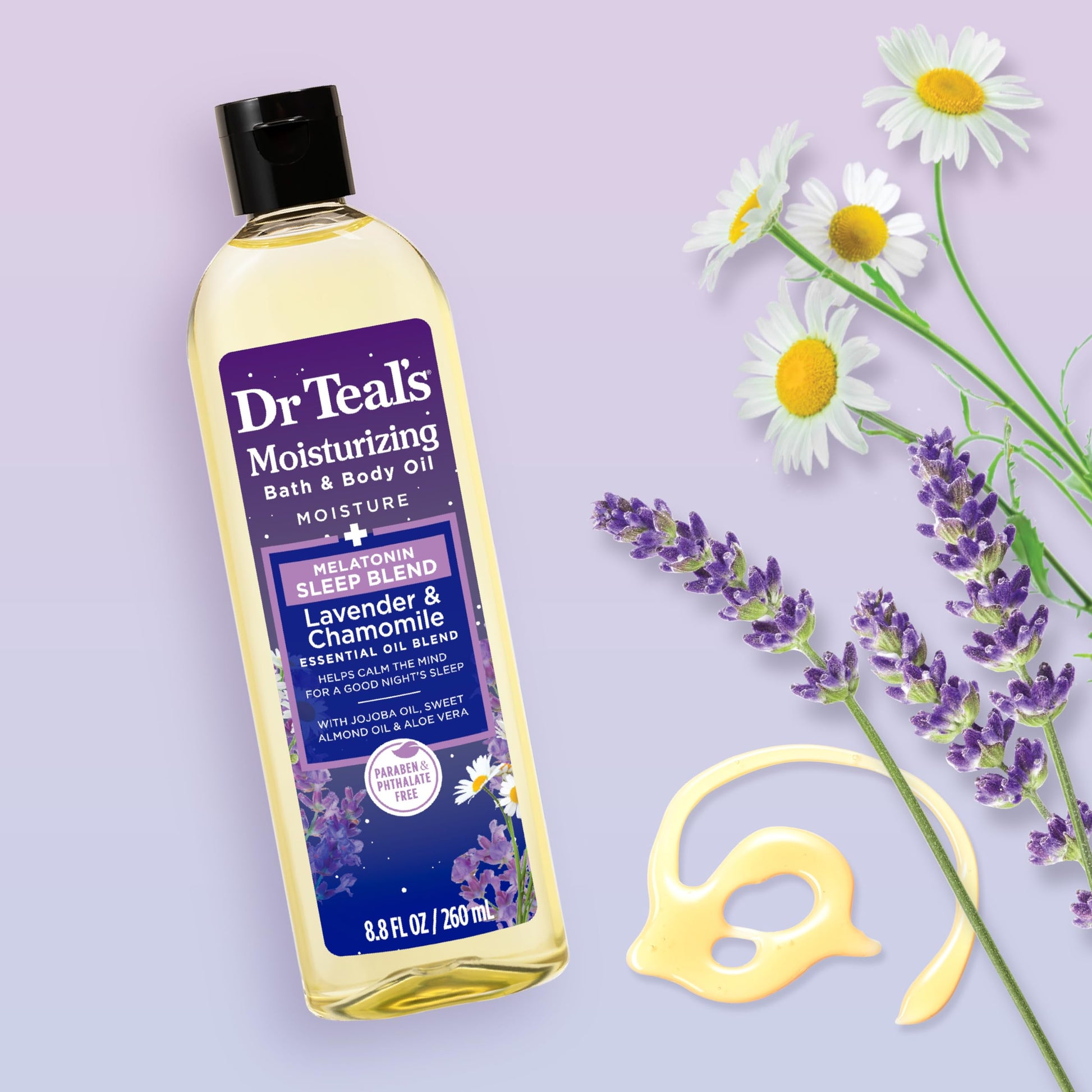 Dr Teal's lavender and chamomile body oil bottle placed in a cozy nighttime bedroom setting