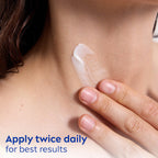 Texture of Nivea skin firming and anti wrinkle cream on a fingertip