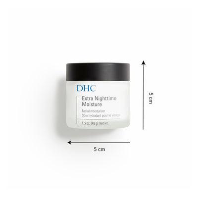 Open jar of DHC Extra Nighttime Moisture revealing the rich white cream texture