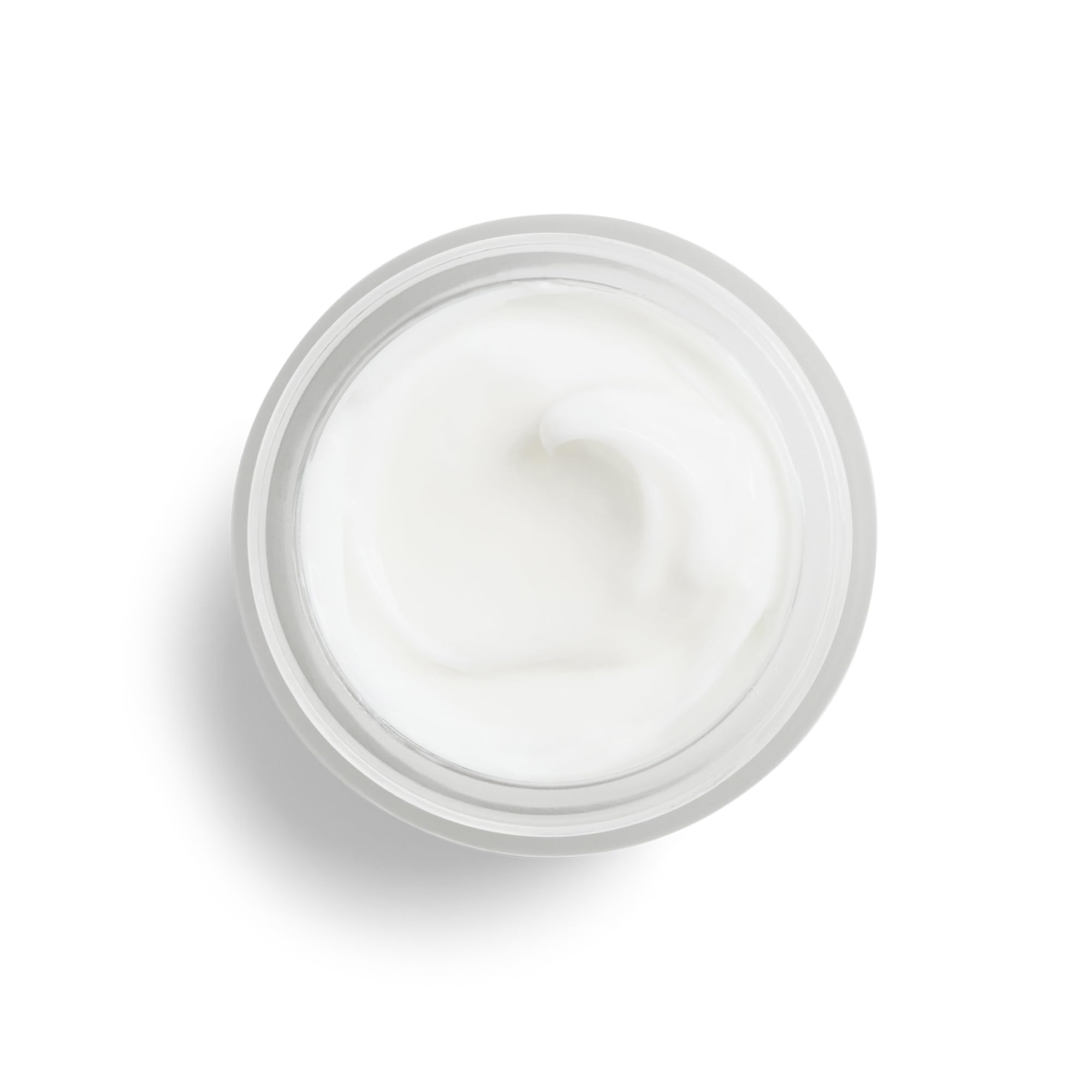 DHC skin renewing night cream placed on a clean vanity surface for nighttime routine