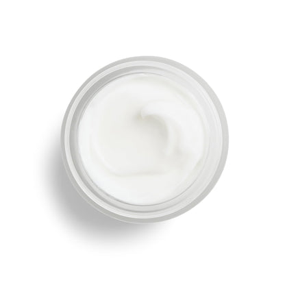 DHC skin renewing night cream placed on a clean vanity surface for nighttime routine