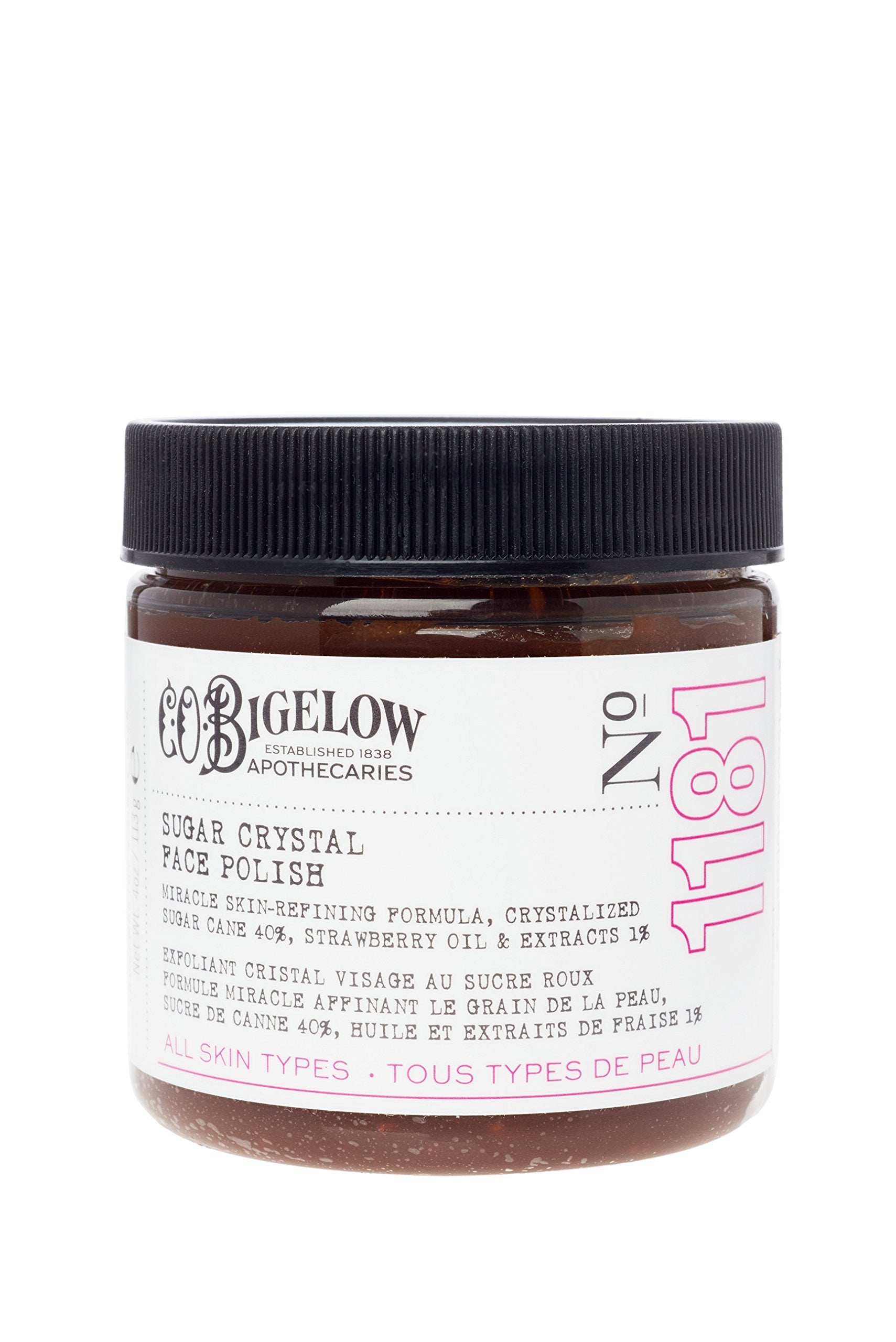C.O. Bigelow Face Care Collection strawberry oil scrub jar opened to reveal the rich texture of natural sugar crystals.
