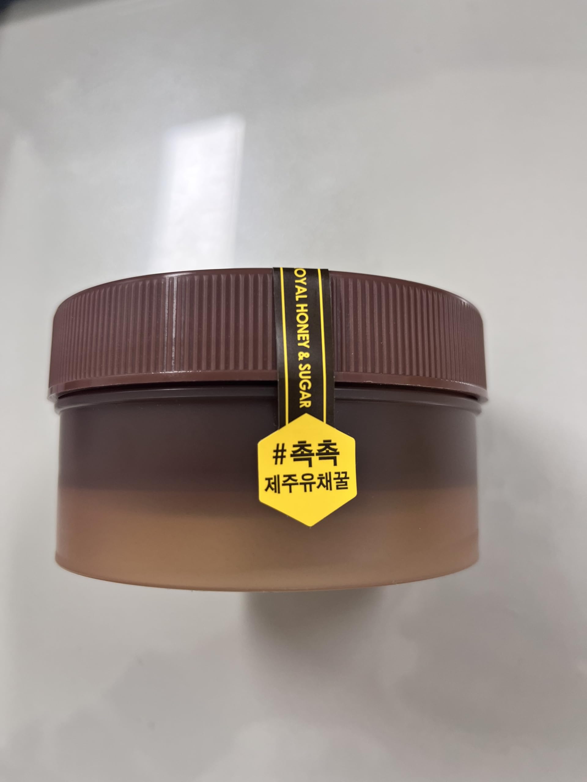 Applying Neogen Real Polish honey scrub to damp skin