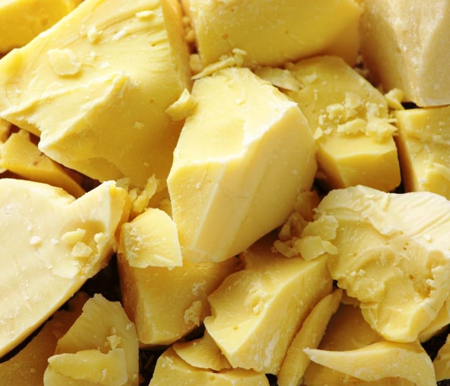 Close up of nutrient rich raw unrefined shea butter scoop