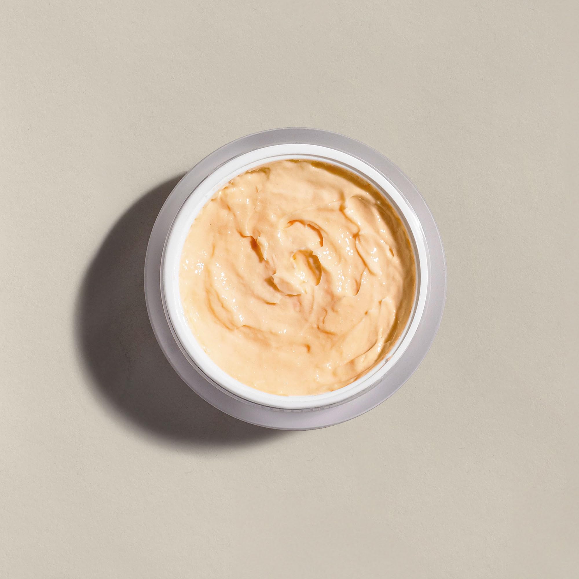 Colleen Rothschild Resurface Brighten and Soften facial treatment texture close up highlighting exfoliating microspheres.
