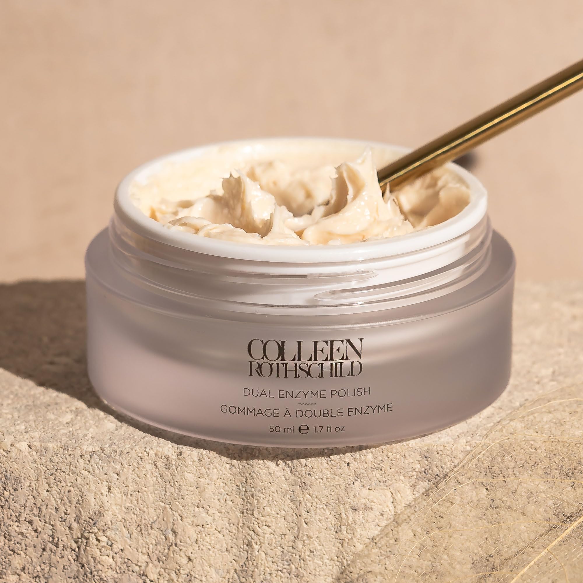Colleen Rothschild luxury skincare collection displaying the premium exfoliating jar on a vanity.