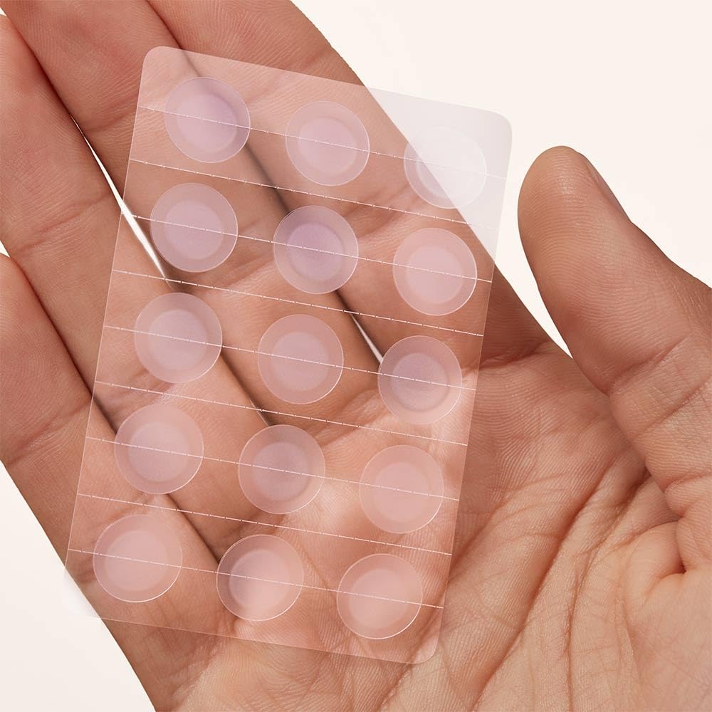 Clear 12mm hydrocolloid pimple stickers sheet showing textured medicated acne dots
