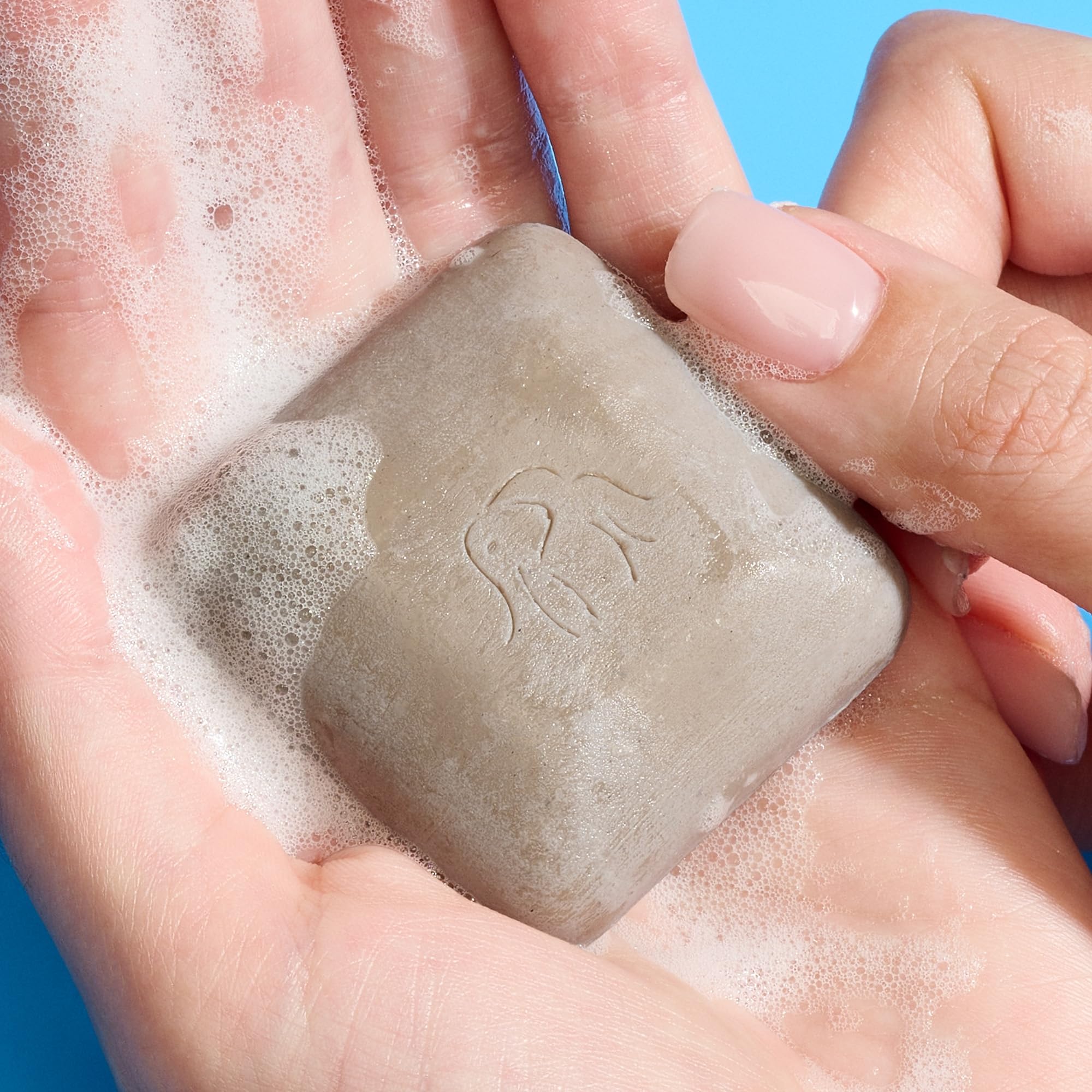 Drunk Elephant travel size facial cleansing bar duo on flat surface