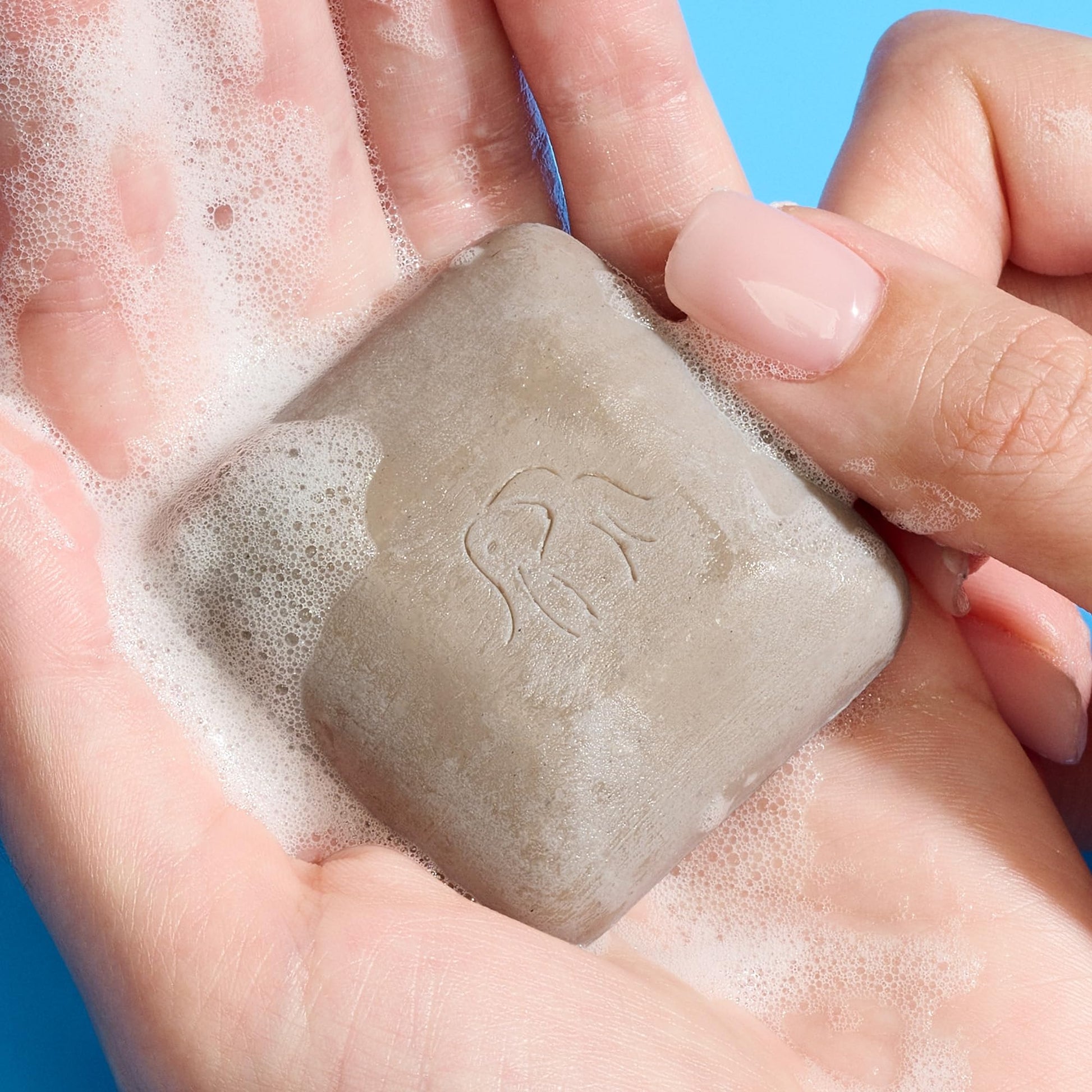Drunk Elephant soap free exfoliating face wash bar showing authentic product packaging