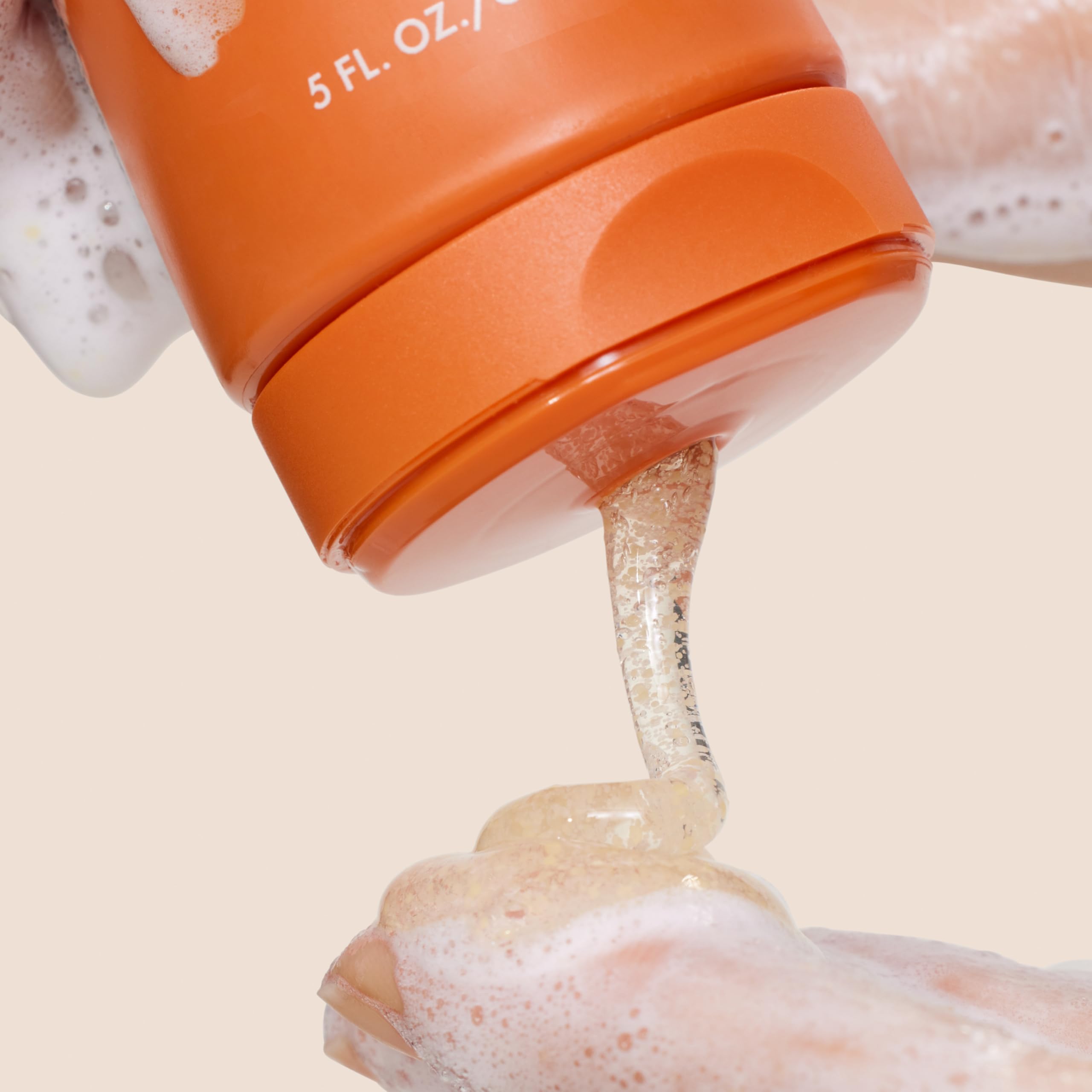 Back label of Origins GinZing exfoliating face wash with ingredients and usage directions