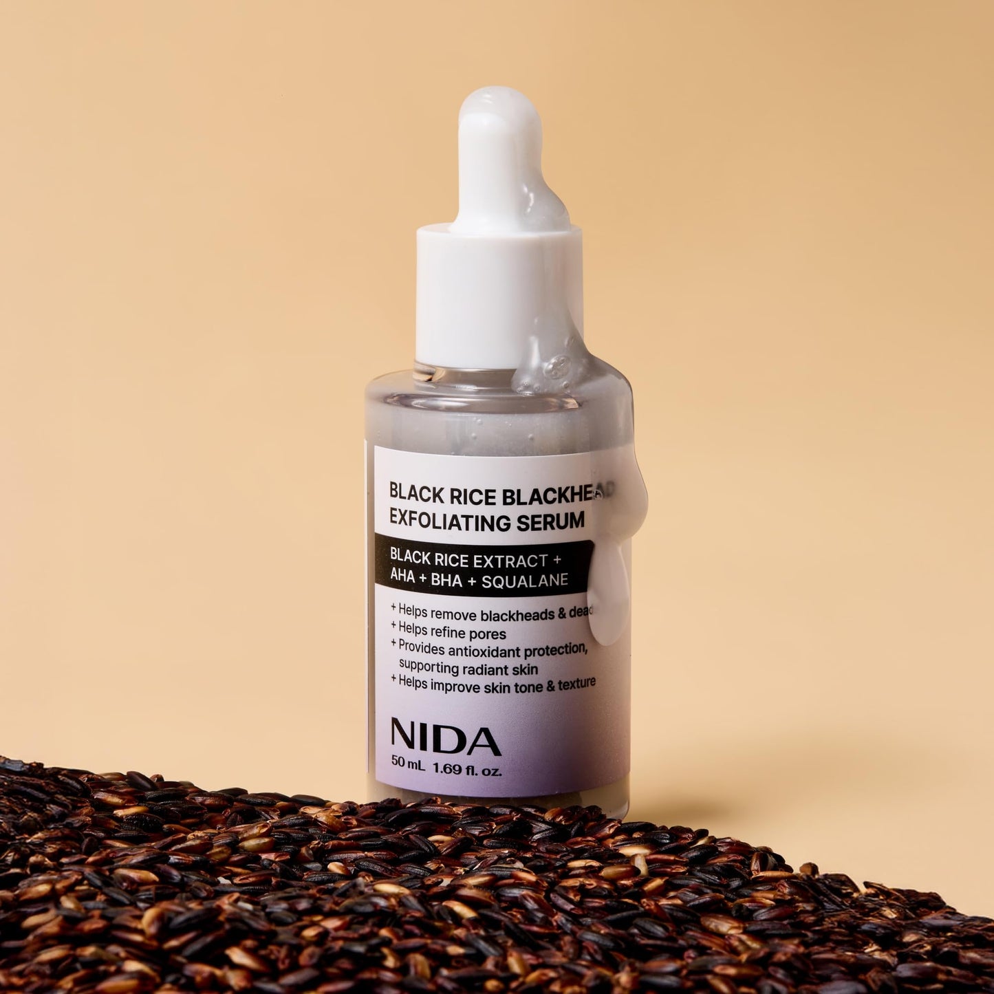 Skincare bottle of NIDA black rice extract dead skin cells remover displayed on flat surface
