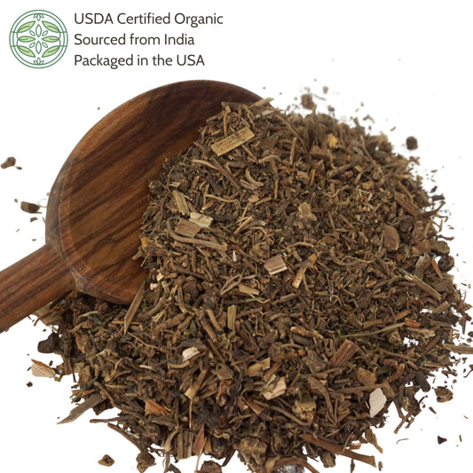 Close up of cut and sifted organic valerian root loose leaf herbal pieces showing natural dried texture.