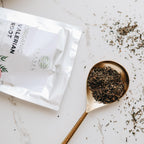 Organic valerian root cut pieces inside a tea infuser demonstrating proper preparation step for sleep support.