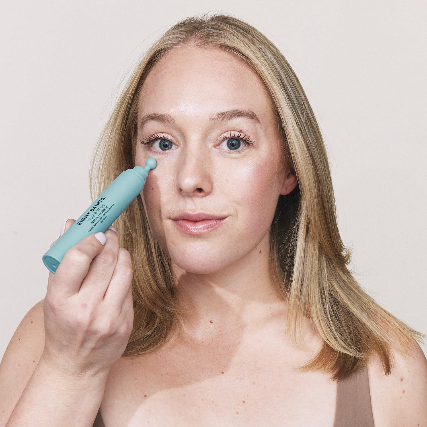 Lightweight gel eye serum texture from Eight Saints being applied to skin.