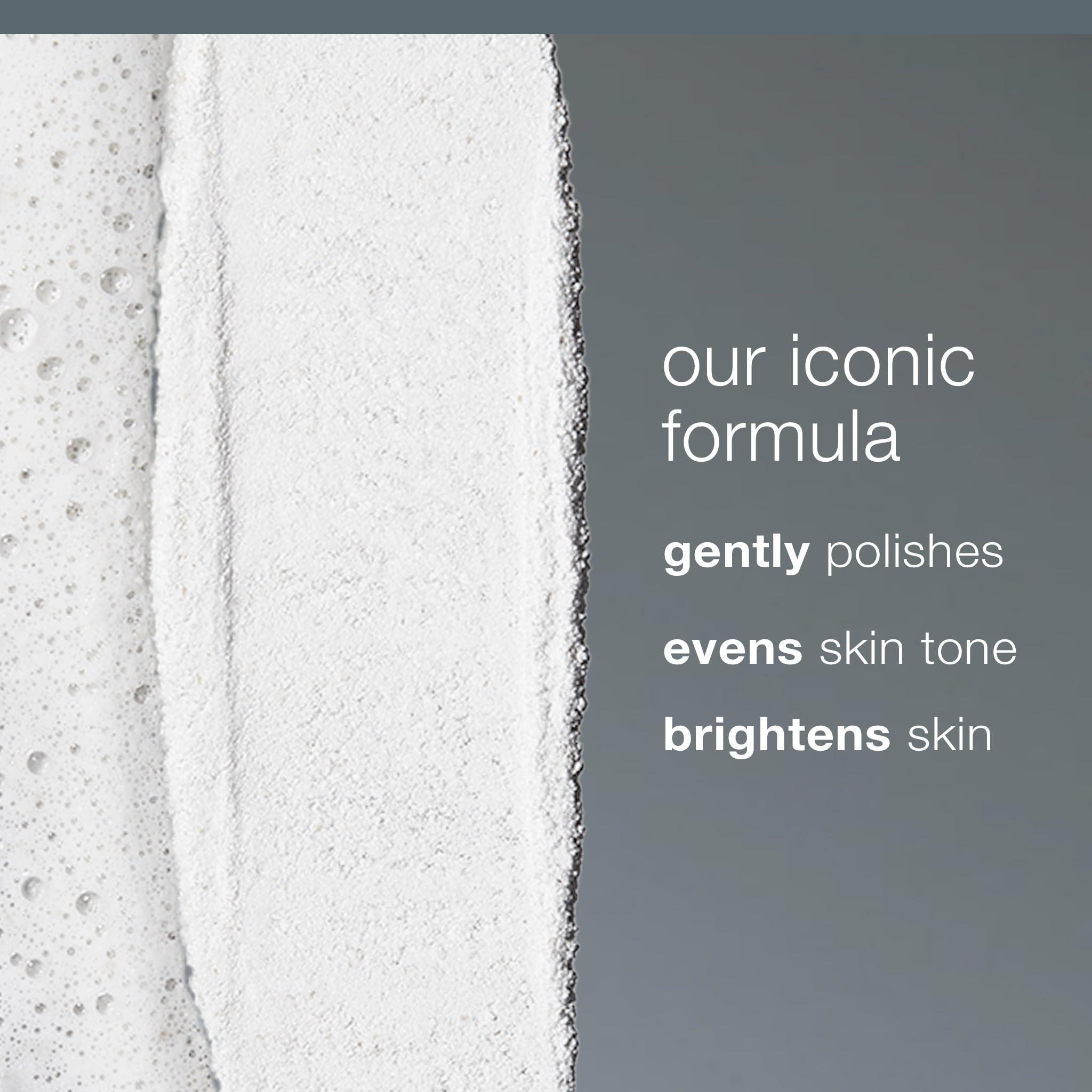 Dermalogica powder exfoliator bottle close up on white background.