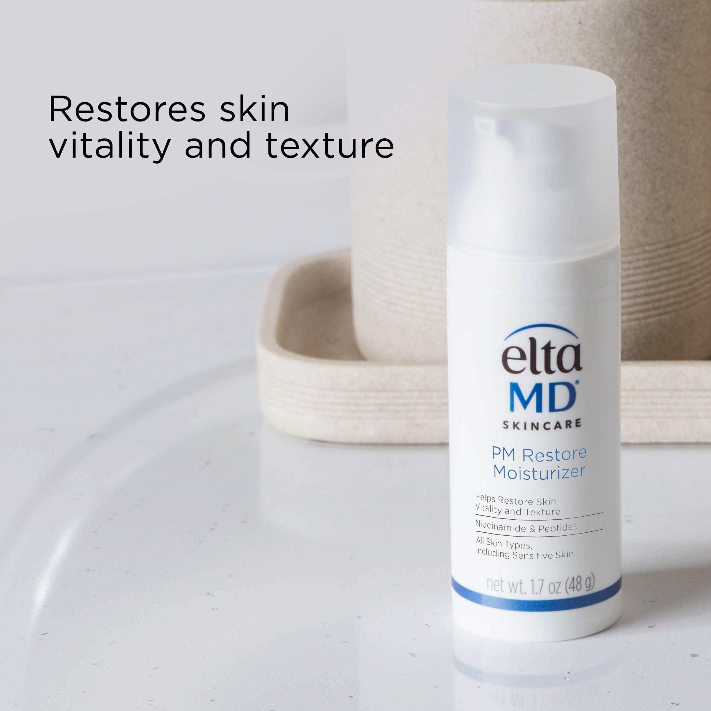 EltaMD PM Restore Face Moisturizer being dispensed showing its lightweight cream texture.