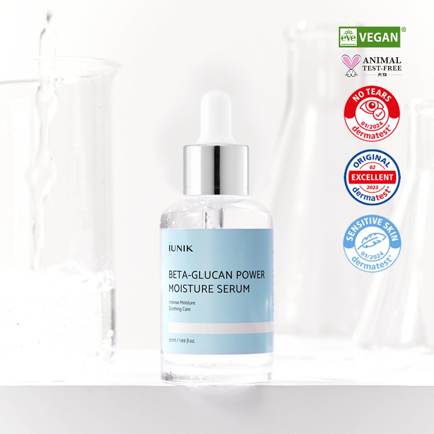 Vegan lifting and hydration face serum liquid being dispensed from the dropper