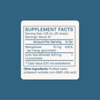 BodyBio Liquid Manganese bottle side view with ingredients