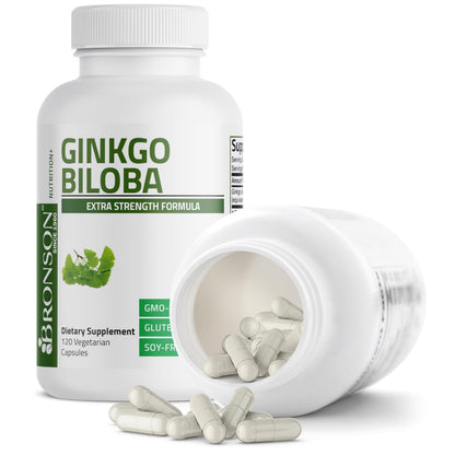 Single vegetarian capsule displayed next to the Bronson Ginkgo Biloba bottle to illustrate size and format