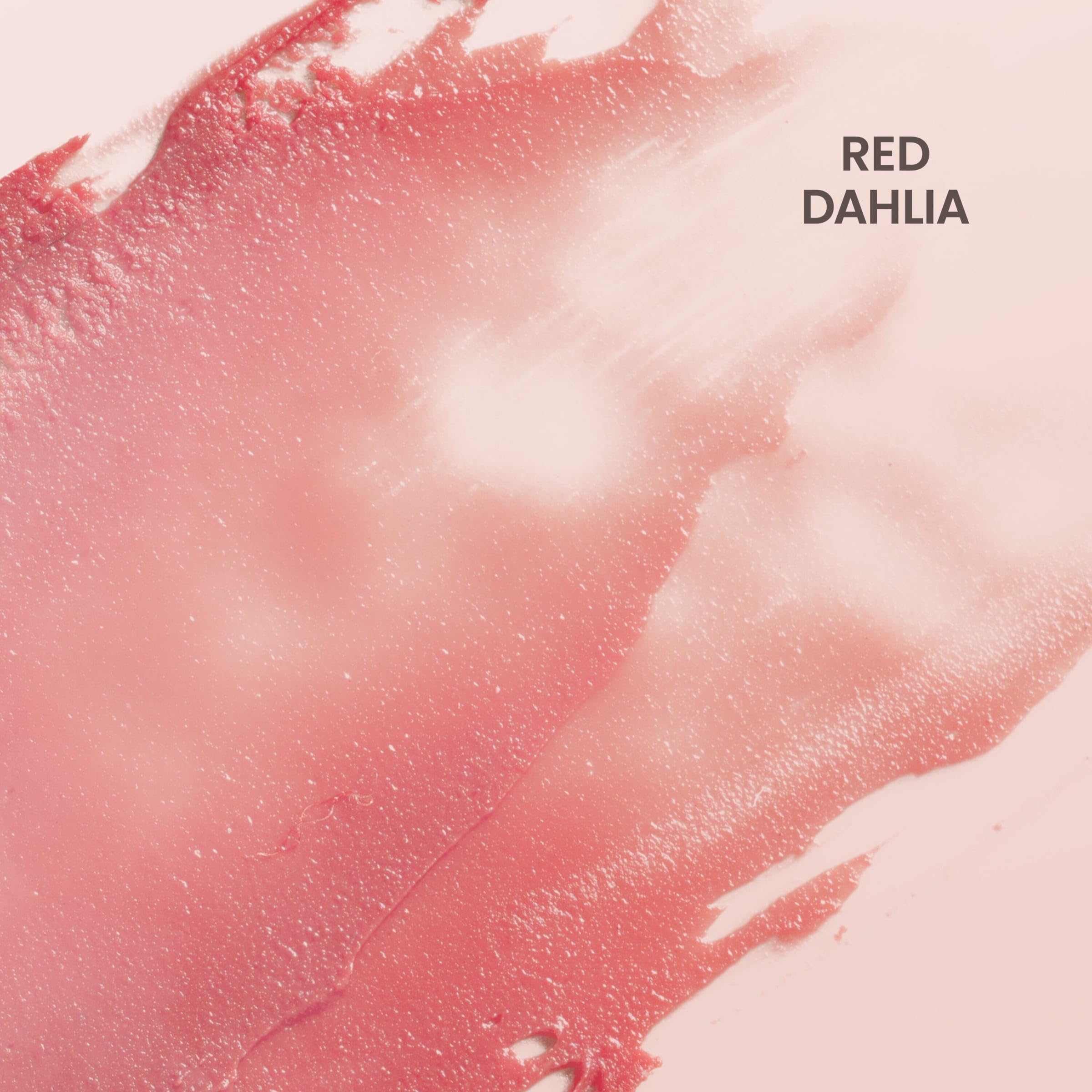 Burt's Bees lip makeup swatch on skin displaying the sheer semi glossy finish of Red Dahlia.