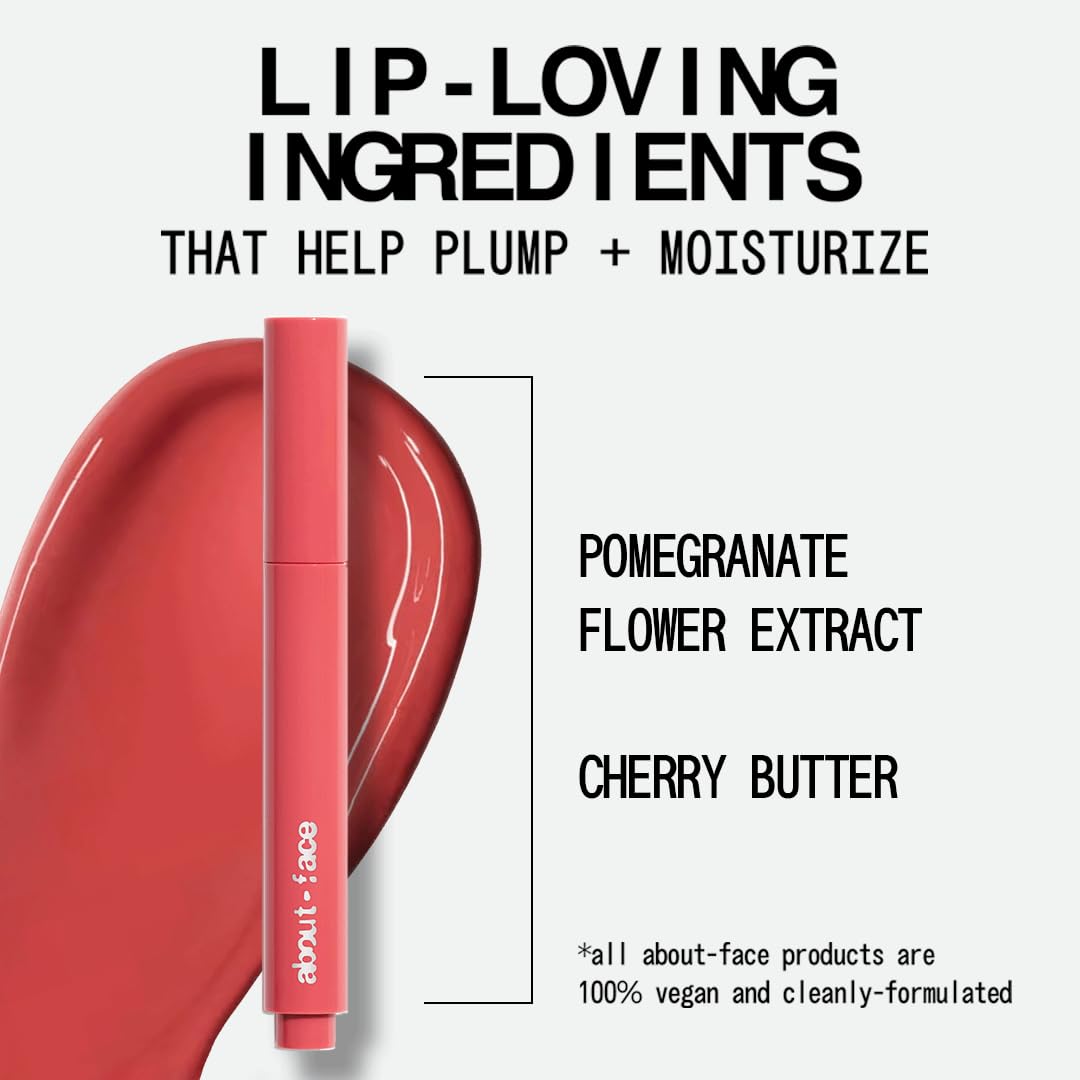 Model wearing aboutface cherry pick lip color butter pinky coral