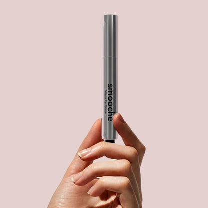 Lifestyle shot of Smooche Extreme Lip Plumper tube