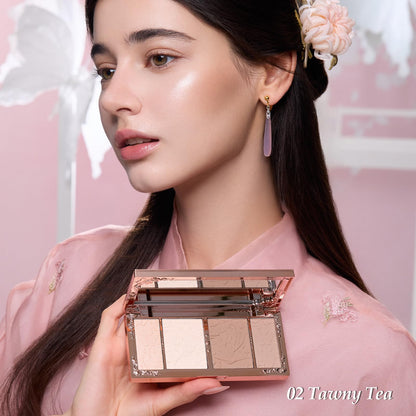 Top view of the luxury imported embossed highlighter and contour compact with built in mirror.
