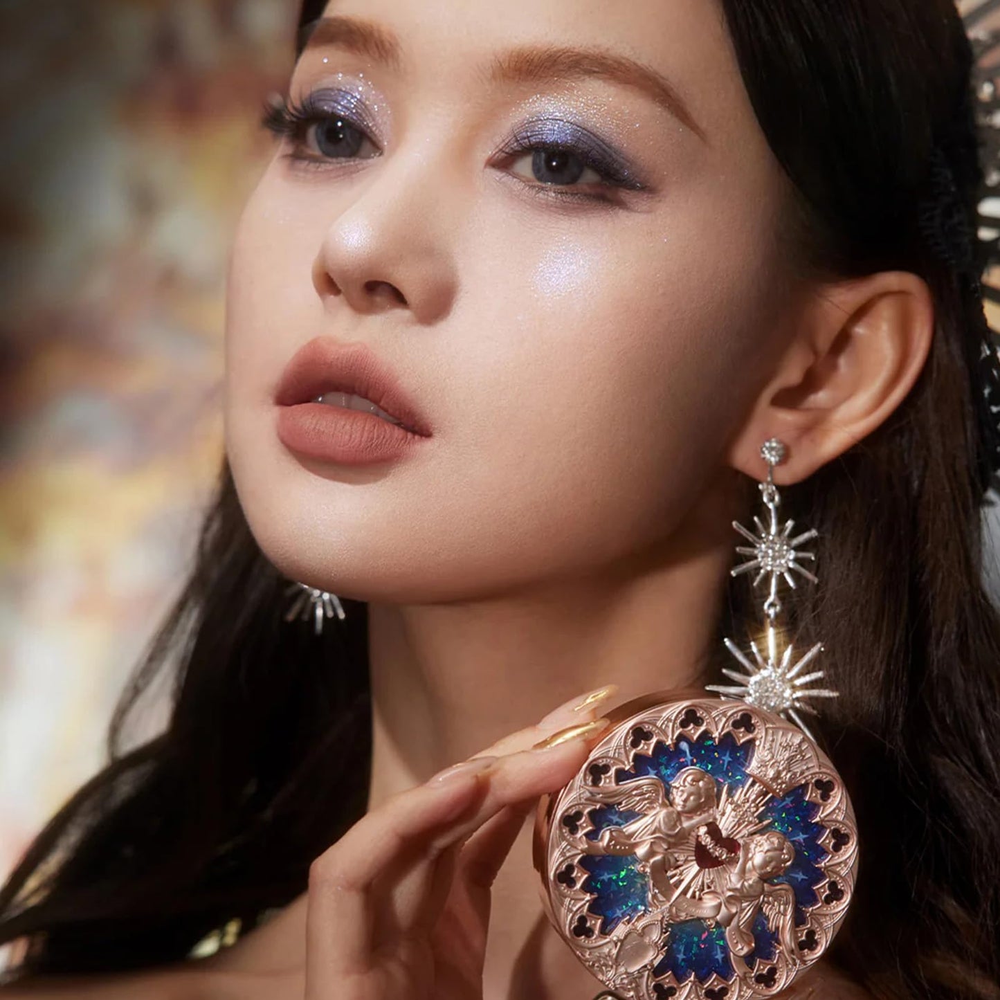 Close up of the velvety blue-purple and white pearl shimmer face powder