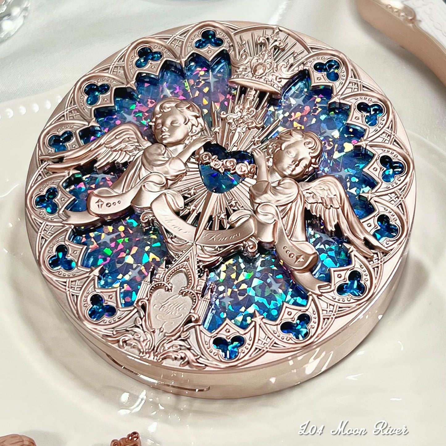 Galaxy inspired cool toned highlighter powder compact for a glassy skin finish