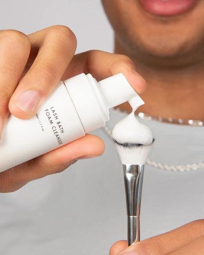 Close up of Borboleta Lash Bath Foam Cleanser texture and bottle packaging