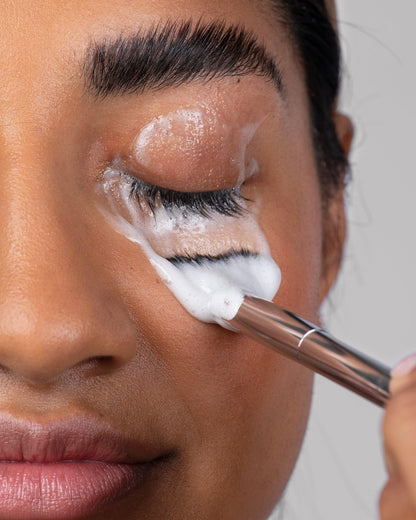 Borboleta Lash Bath Foam Cleanser next to a lash cleaning brush
