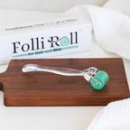 Storage case open with FolliRoll hair and skin roller inside