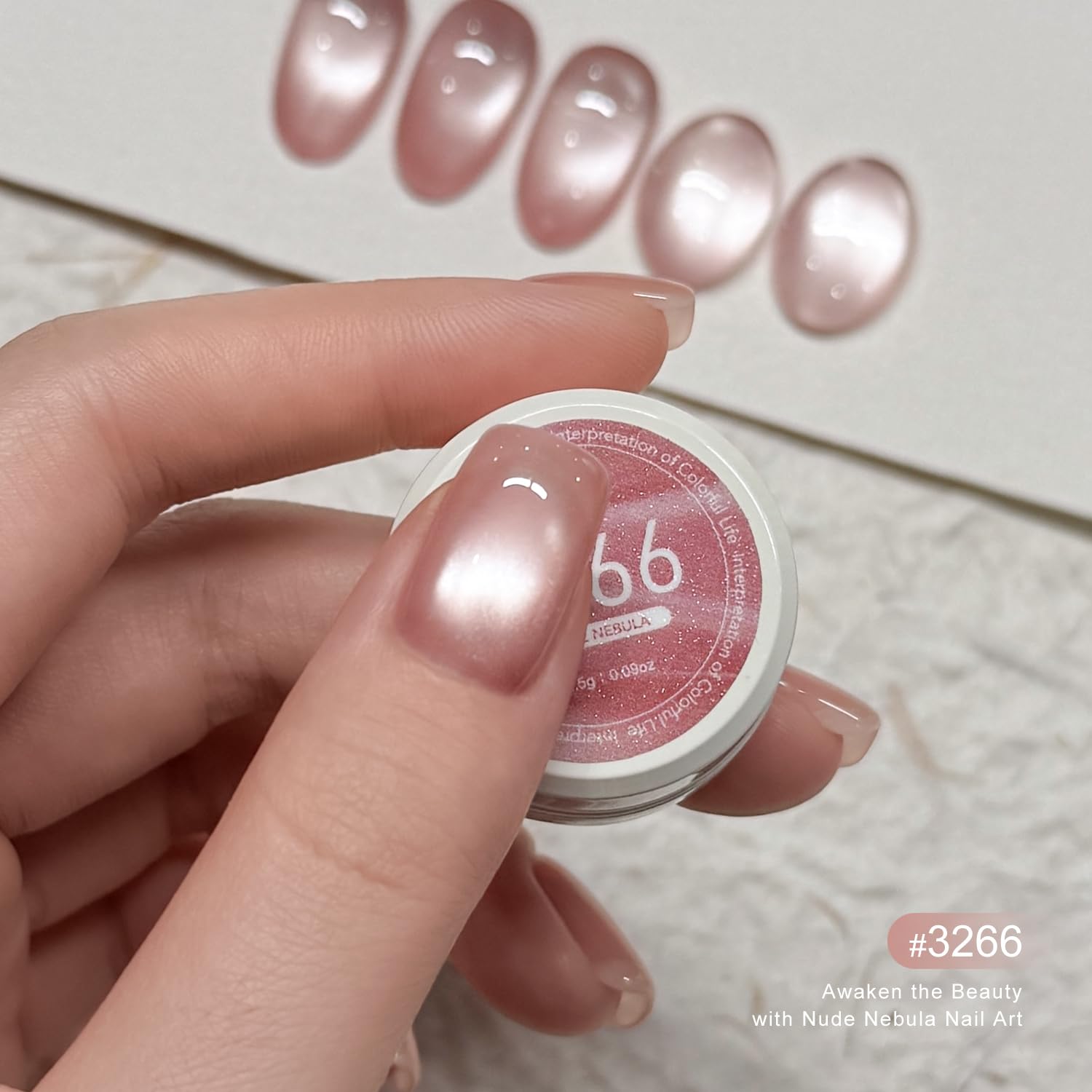 Close up of Gaoy jelly nude cat eye nail art design