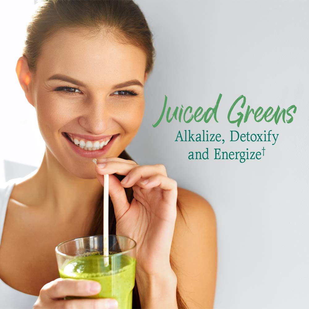 Scooping green juice powder out of the original stevia-free 30 servings container