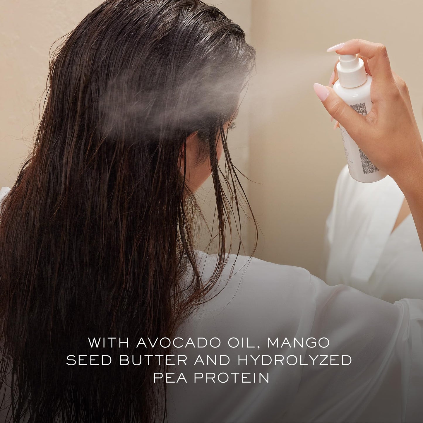 Professional hair blowout using Kristin Ess protection spray
