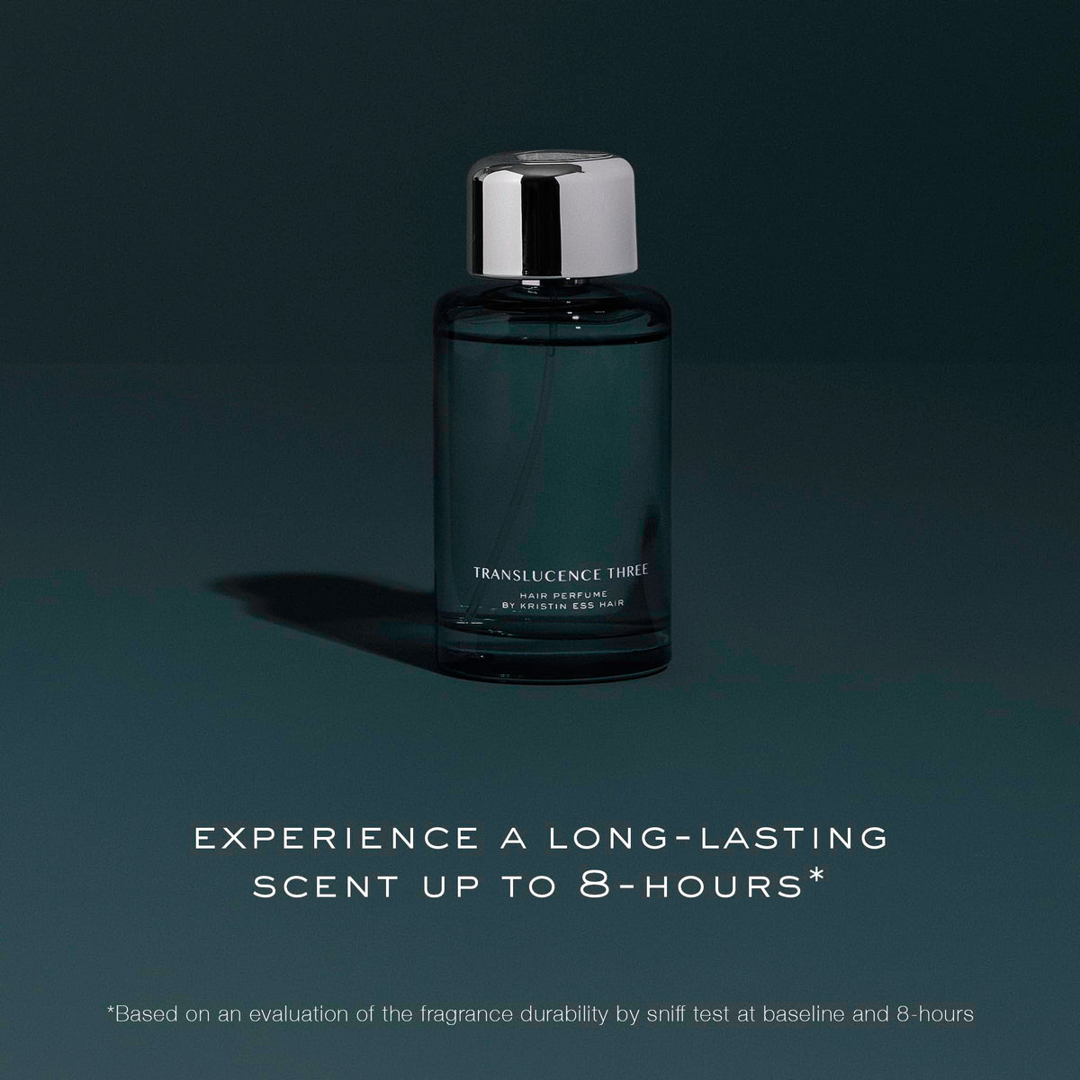 Kristin Ess hair perfume travel size in hand