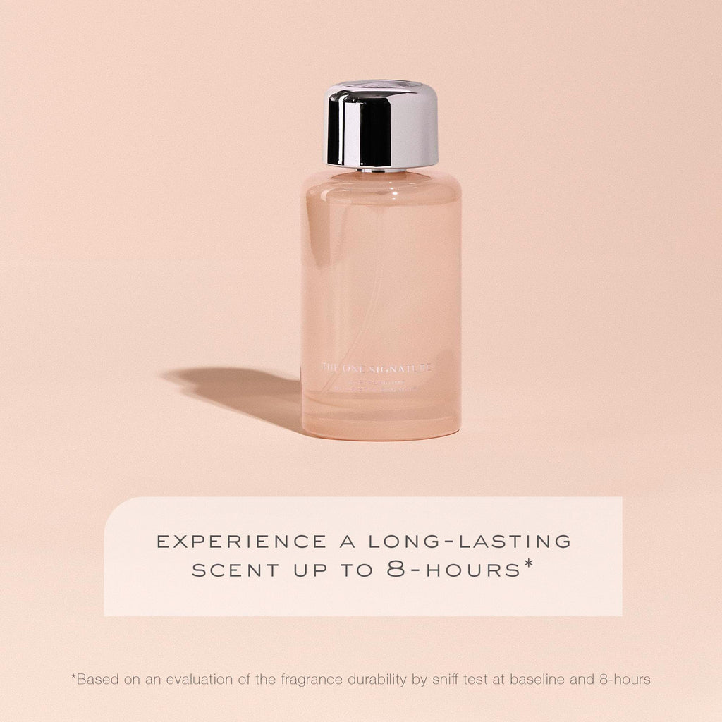 Kristin Ess Signature Hair Perfume held in hand for scale