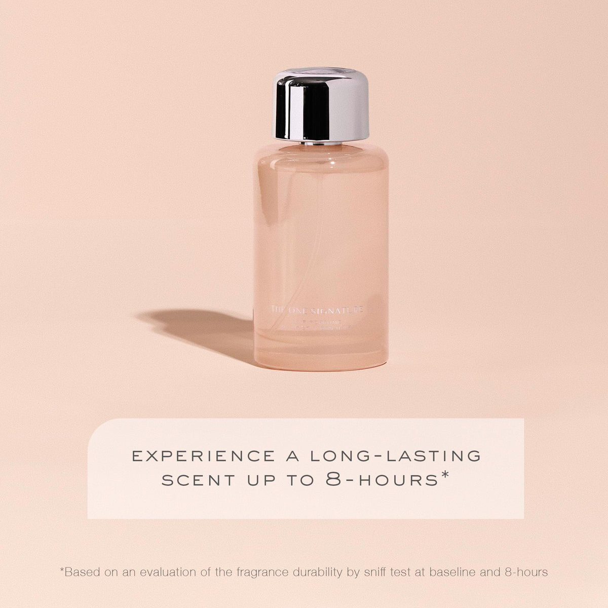 Kristin Ess Signature Hair Perfume held in hand for scale