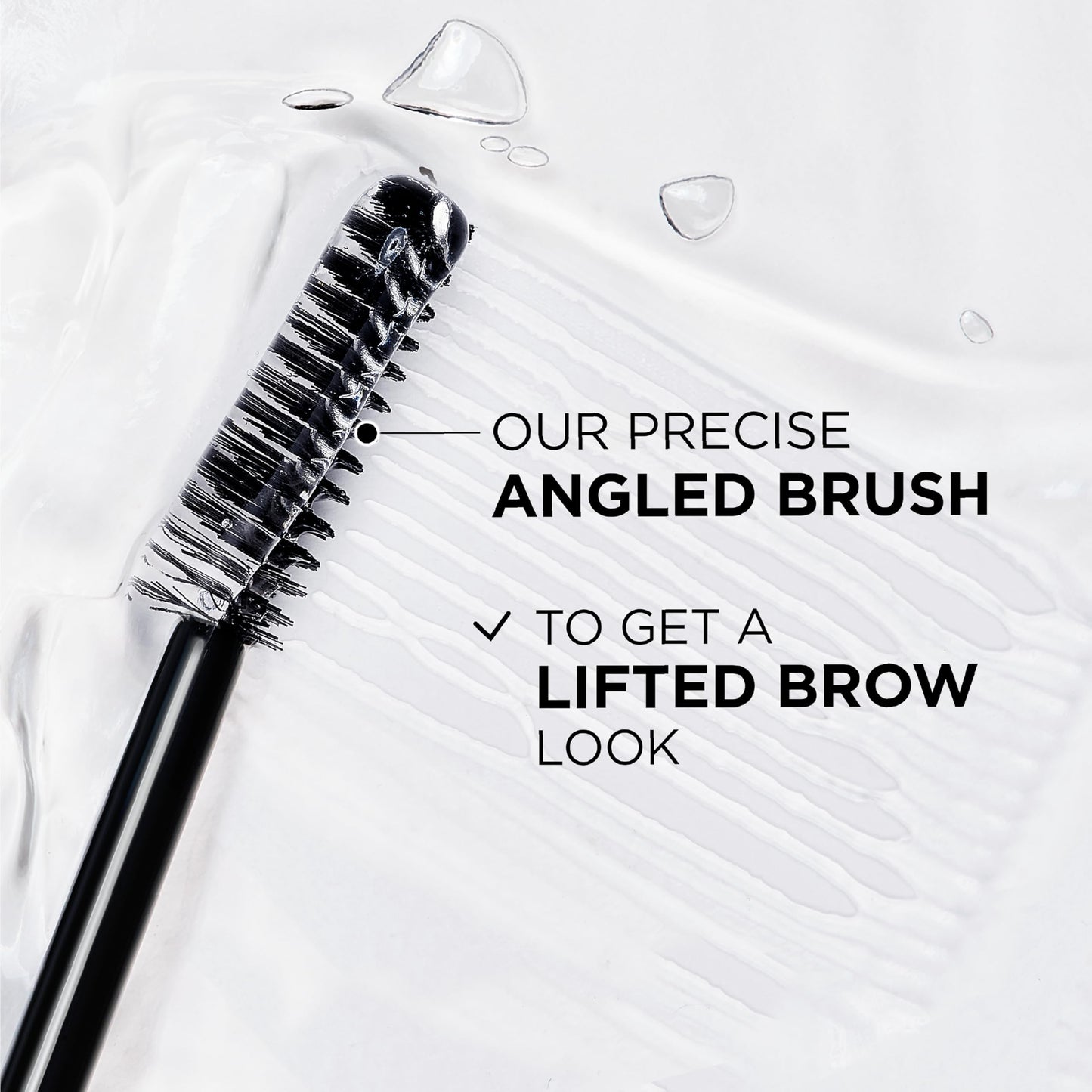 Transparent brow laminator gel brush showing fine bristles for styling