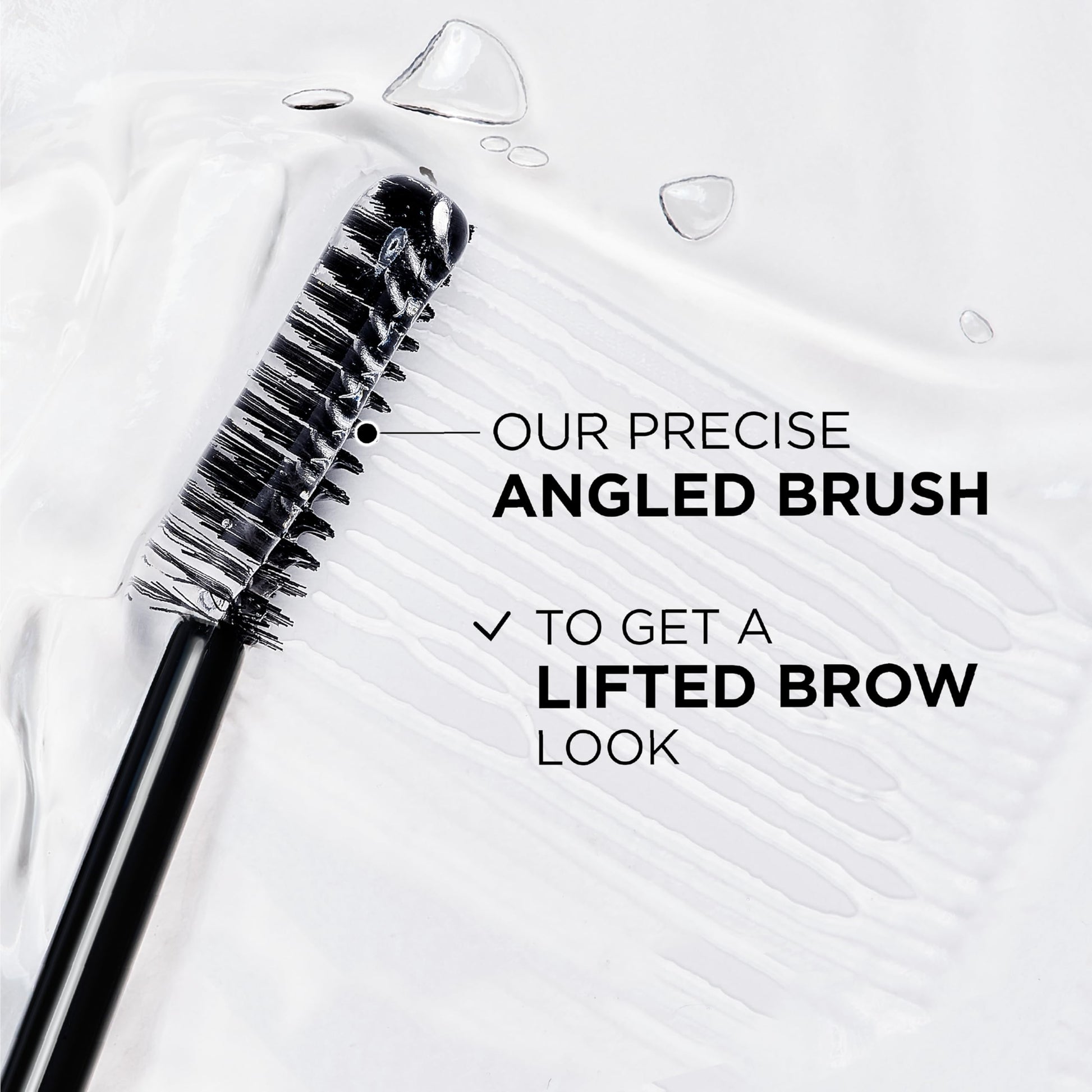 Transparent brow laminator gel brush showing fine bristles for styling