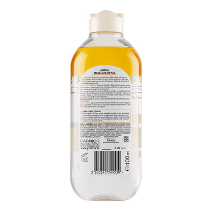 Garnier imported micellar oil infused cleansing water bottle being shaken to blend the two phases for application