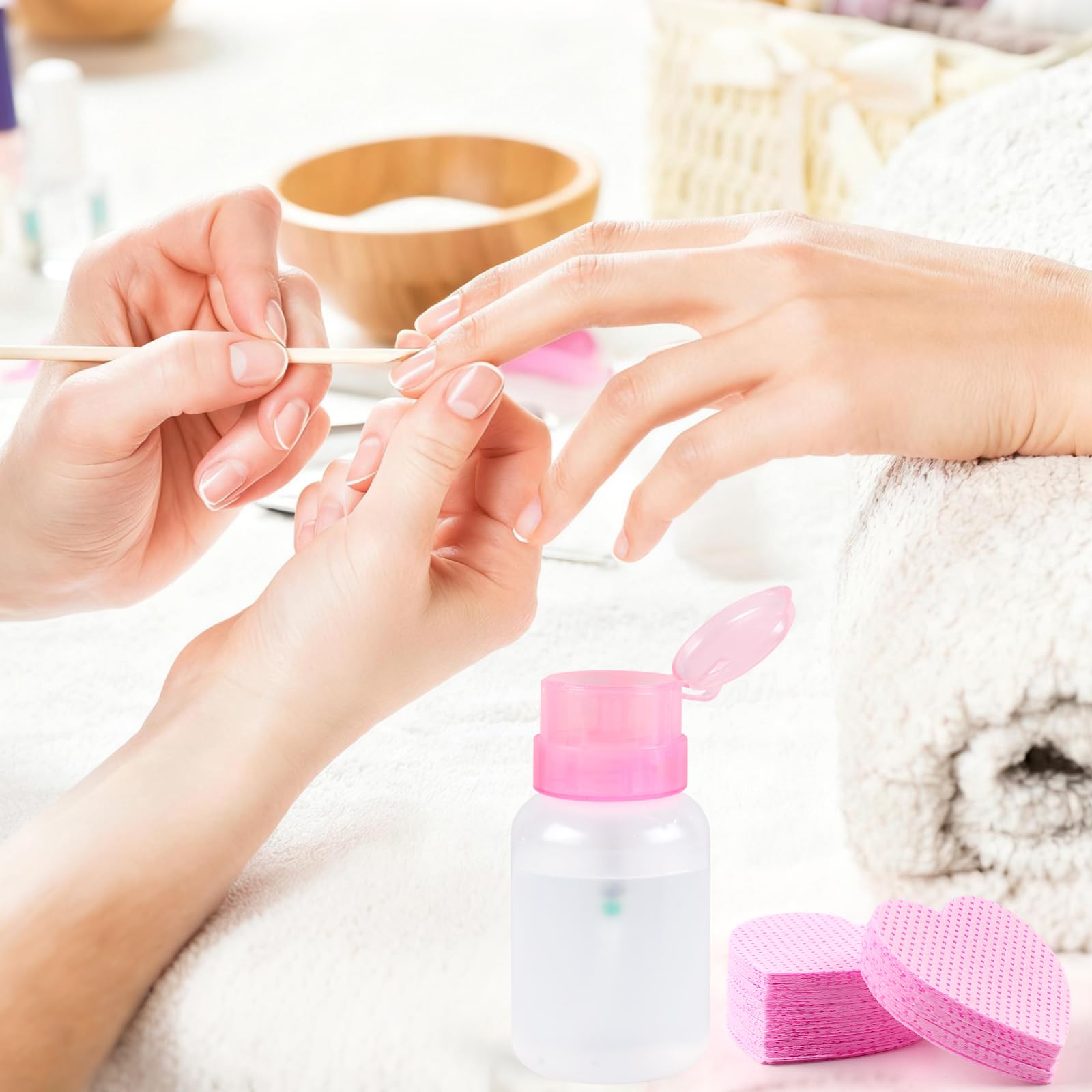 Professional nail technician using lint free wipes and pump bottle