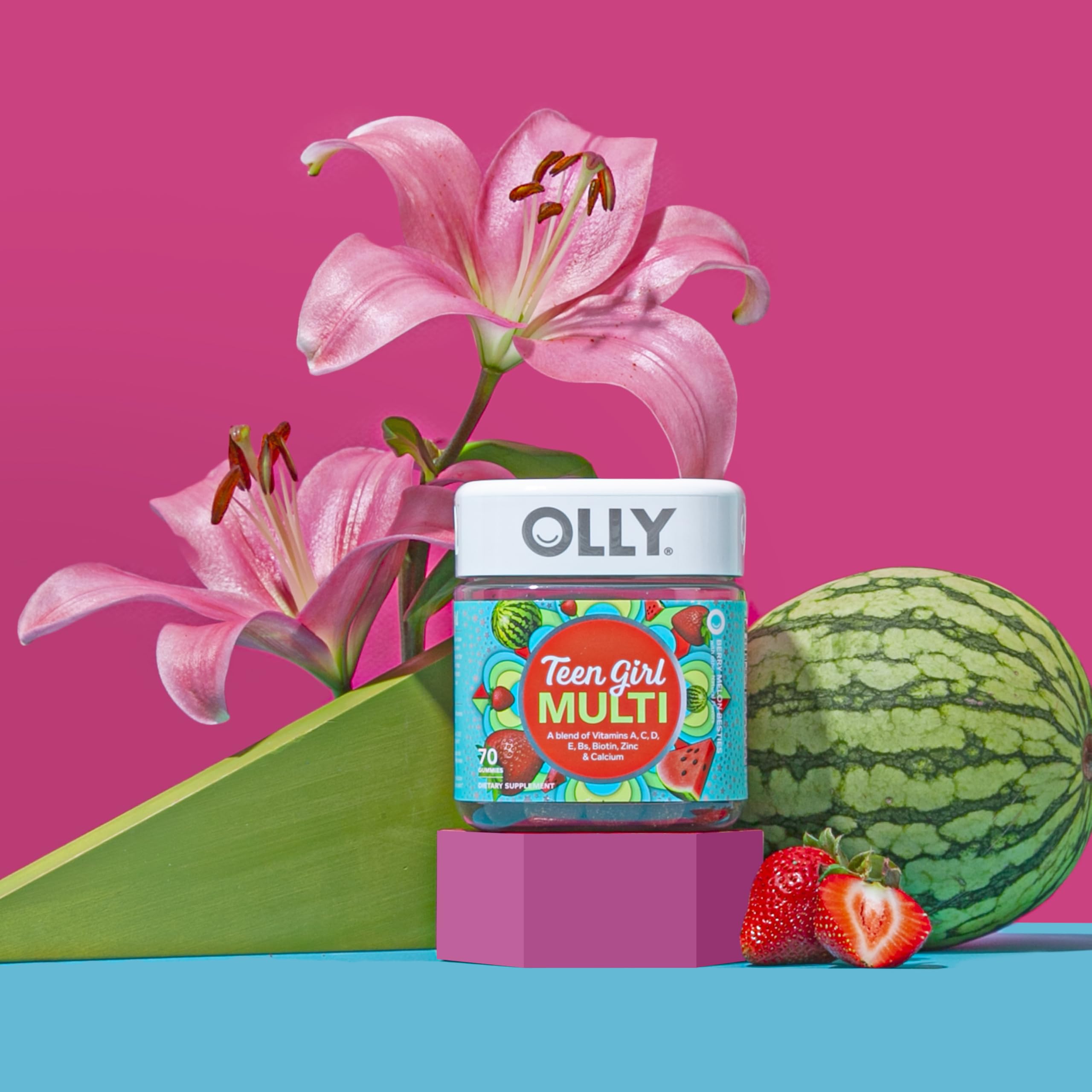 Close up of OLLY premium pectin based teen multivitamin gummies in strawberry melon shade.