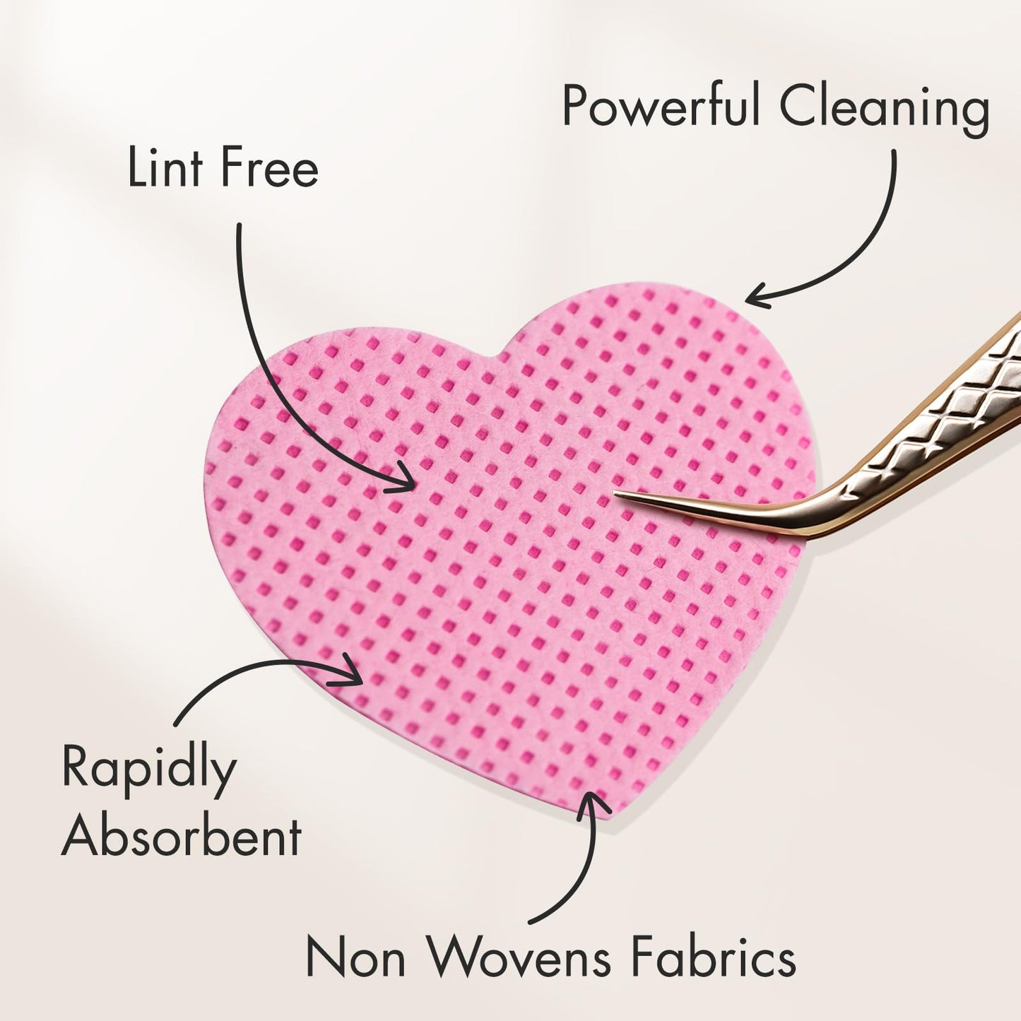 Pink heart shaped lint free nail wipes spread out on surface