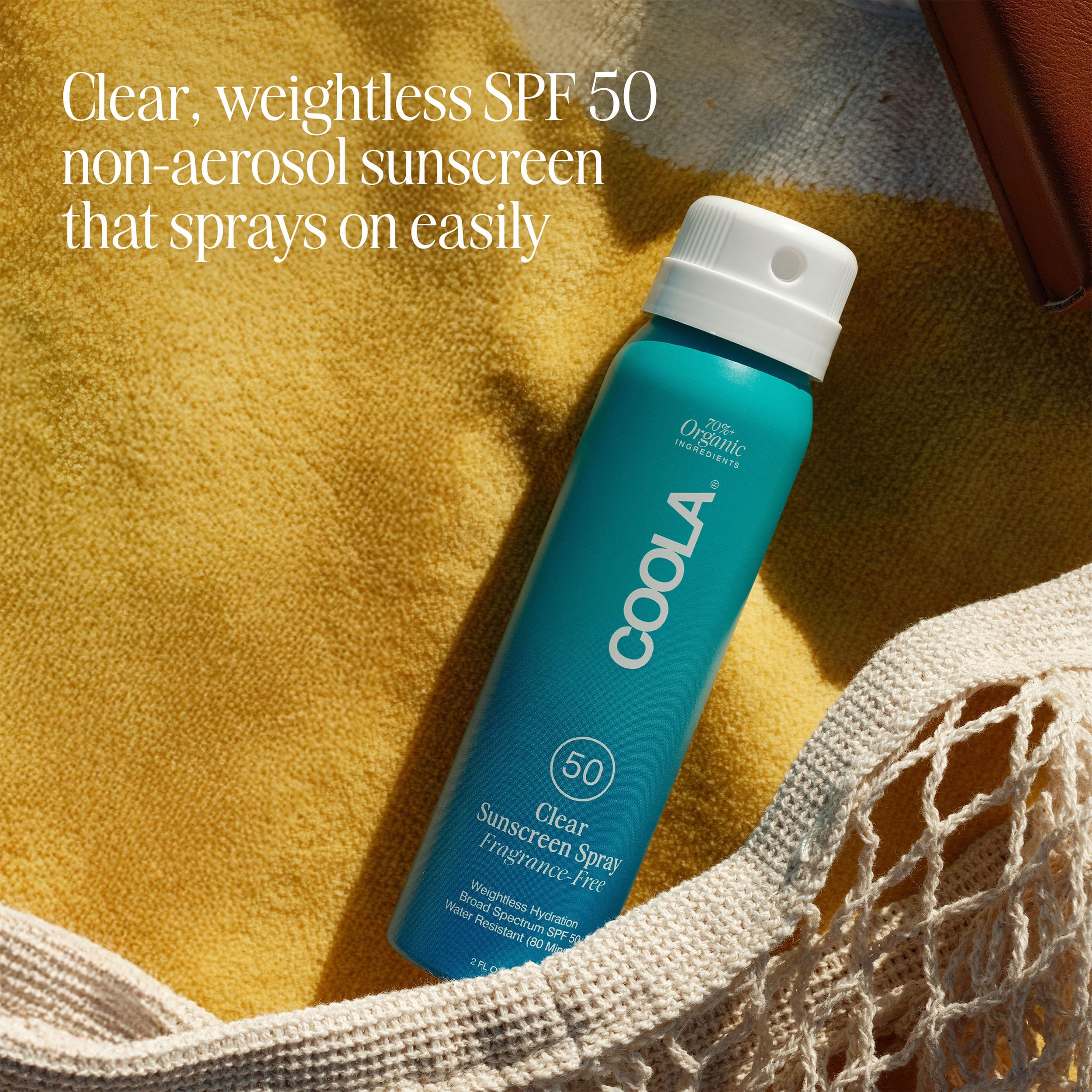 Coola sunscreen spray bottle showing organic ingredients list